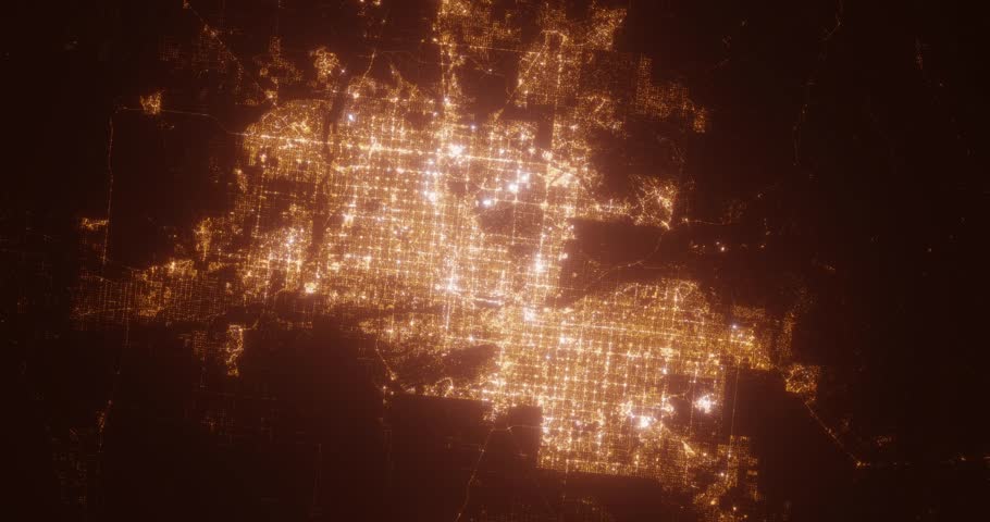 Phoenix (Arizona, USA) aerial view at night. Top view on city from space. Camera is zooming in, rotating clockwise