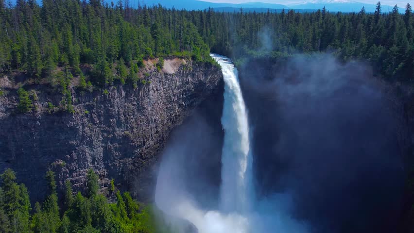 Wells Gray Waterfall in British Columbia, Canada. Amazing and Powerfull Stream, Fog and Splashing water 
