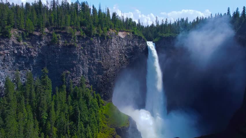 Wells Gray Waterfall in British Columbia, Canada. Amazing and Powerfull Stream, Fog and Splashing water 