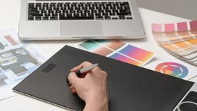 Woman interior designer works on digital graphic tablet with stylus, hand drawing home design project sketches. Creativity and modern technology. - Powered by Shutterstock - Get 15% off with code: PIKWIZARD15