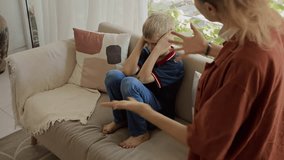Emotional mother arguing with her teenage son of Caucasian ethnicity because of his bad behavior at home - Powered by Shutterstock - Get 15% off with code: PIKWIZARD15