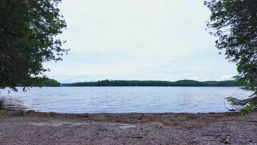 Paudash Lake calm water and pine trees in the area of Bancroft, Kawartha Highlands and Cardiff, Ontario, Canada. Big lake landscape and nature background. Travel destination.