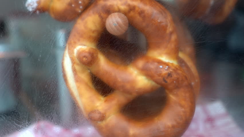 Pretzel hanging selling in Austria Vienna street food stall 4k