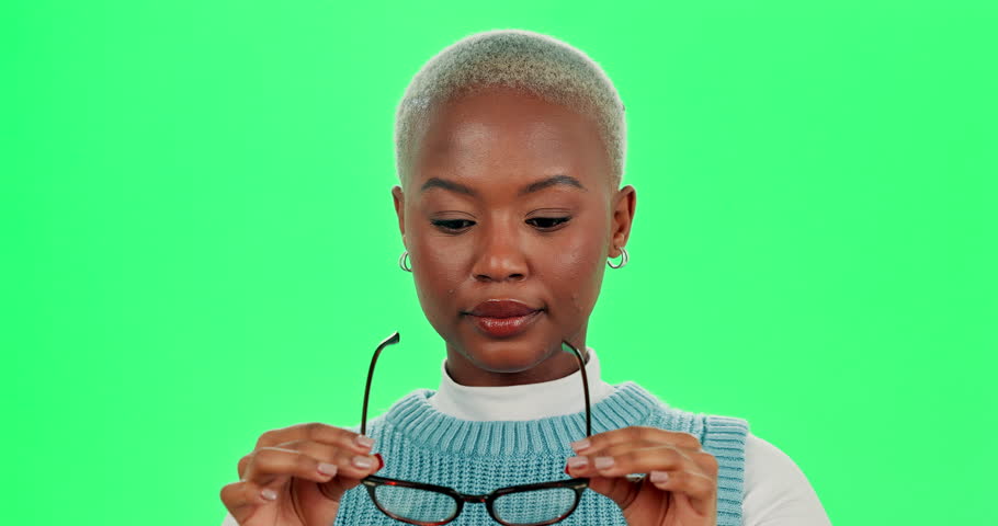 Black woman, face and glasses on green screen for optometry, vision support and cool frames. Female person, portrait and eye care for optical awareness, cosmetics and spectacles for ophthalmology
