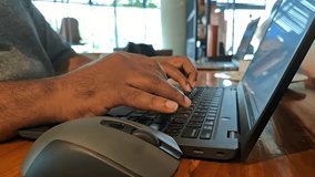 Man hands typing on computer keyboard, business man working on laptop pc. Work from anywhere concept. - Powered by Shutterstock - Get 15% off with code: PIKWIZARD15
