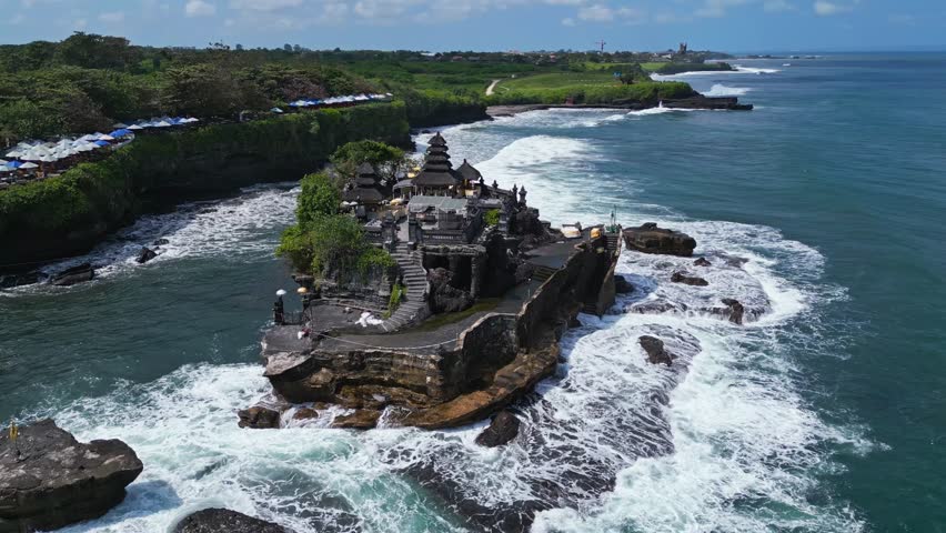 Tanah Lot epitomizes the beautiful romantic island of Bali, aerial parallax