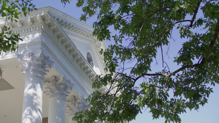 The Rotunda on the campus of the University of Virginia in Charlottesville, Virginia with gimbal video close up pan right to left.