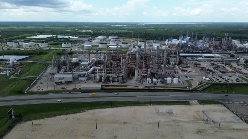 Working large oil refinery complex with crude oil distillation unit, storage tanks, utility systems, pipelines in agriculture agro-town San Antonio, Texas, produce gasoline, diesel, benzene, LPGs. USA