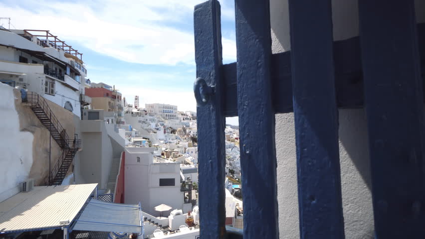 Santorini town Fira, Greece panoracmic with white houses and high volcanic rocks and blue sea