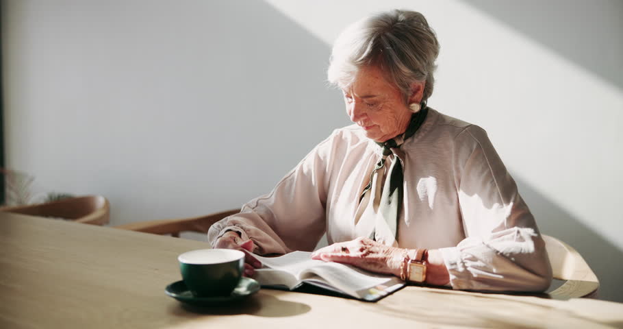 Elderly woman, reading and faith for bible study, heaven and learning knowledge of Christian scripture. Senior person, religion and coffee for spiritual worship or teaching of gospel of Jesus Christ