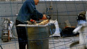 Animation of financial data processing over caucasian male mechnic working in workshop. Business, finances, computing, workshop and digital interface concept digitally generated video. - Powered by Shutterstock - Get 15% off with code: PIKWIZARD15