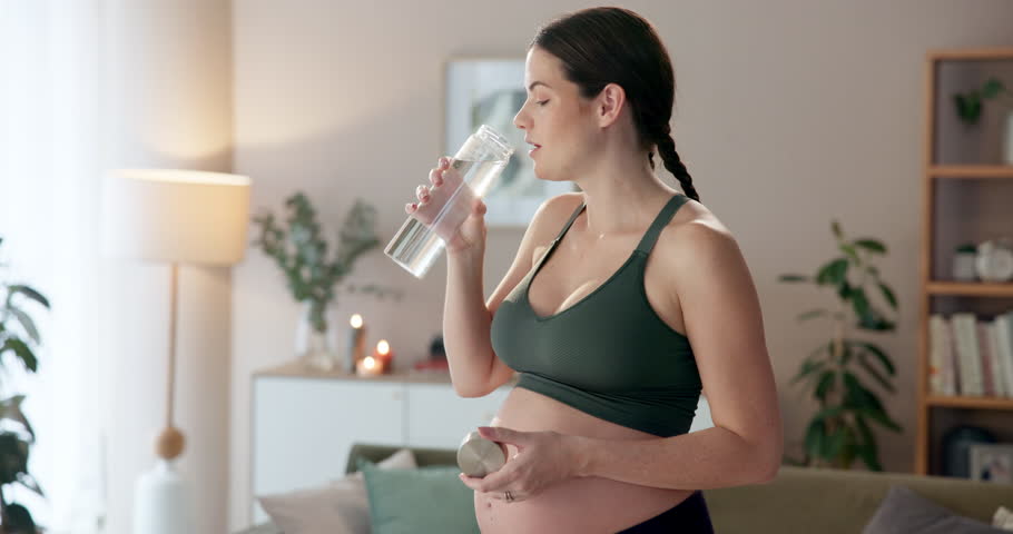 Home, woman and drinking water for healthy pregnancy with wellness, easy digestion and fitness for energy. Pregnant lady, thirsty and bottle with liquid for diet nutrition, exercise and hydration