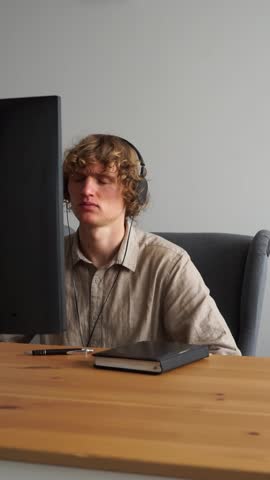 emotionless near computer vertical video