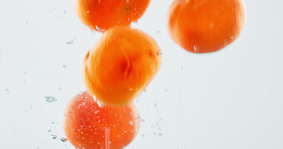 Fruit, orange and vitamin c with water splash for diet, nutrition or fresh produce in studio on a white background. Closeup of juicy, citric acid or hydration of natural organic food on healthy detox