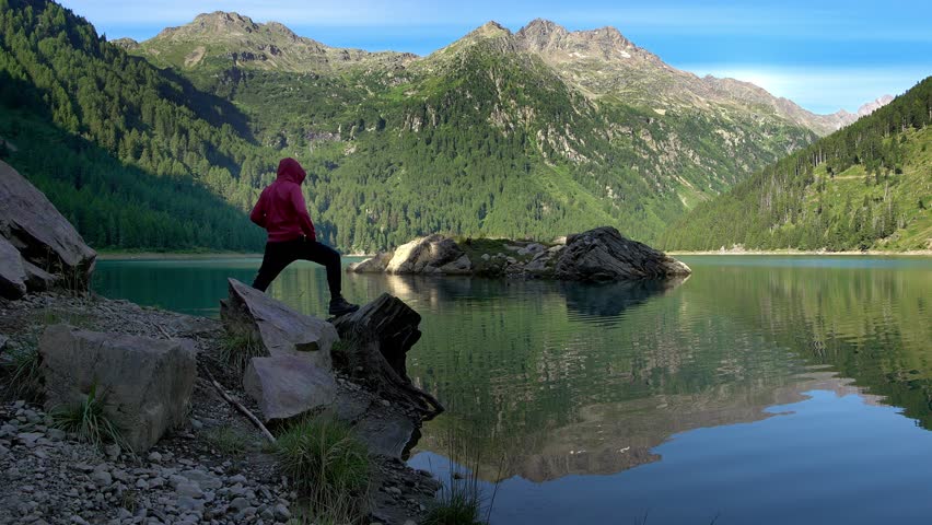 Boy meditates and relaxes on Pian Palu lake