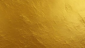 Gold wall texture background. Yellow shiny gold foil paint on wall sheet with gloss light reflection, vibrant golden paper luxury wallpaper. Seamless looping animation - Powered by Shutterstock - Get 15% off with code: PIKWIZARD15