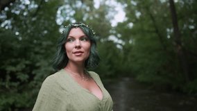 Beautiful nymph woman with dyed green hair and leaves crown on wild forest background. Cosplay wedding, elf princess in fairy tiara, fantasy costume - Powered by Shutterstock - Get 15% off with code: PIKWIZARD15