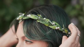 Beautiful nymph woman with dyed green hair and forest leaves crown. Cosplay wedding, elf princess in fairy tiara, fantasy make-up - Powered by Shutterstock - Get 15% off with code: PIKWIZARD15