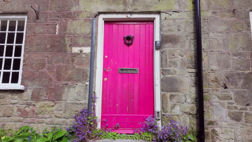 Pink front door from street. Fuchsia painted door in old house.