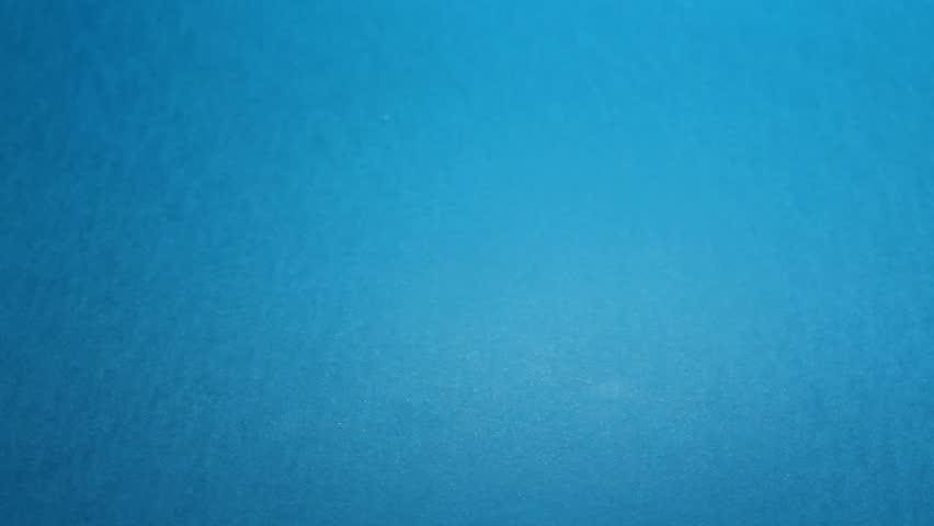 Looping video for Happy Easter. Top view. White boiled chicken egg rolls from corner to corner on blue background. Breakfast ingredient, scrambled eggs, omelet. Infinity concept. Loop. Table close up