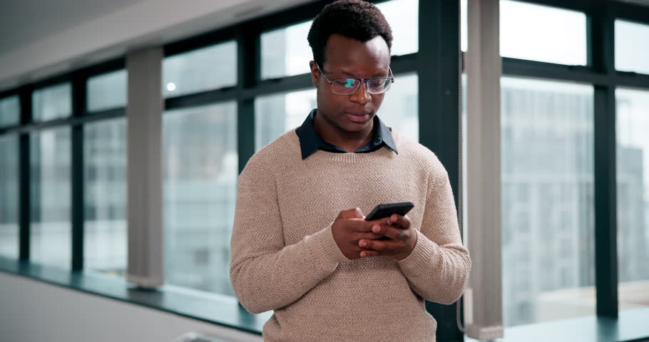 Business man, serious thinking and phone with phishing email, digital scam and fake news in office. Angry guy, contemplating and frustrated for mobile hacking, identity fraud and cybersecurity threat