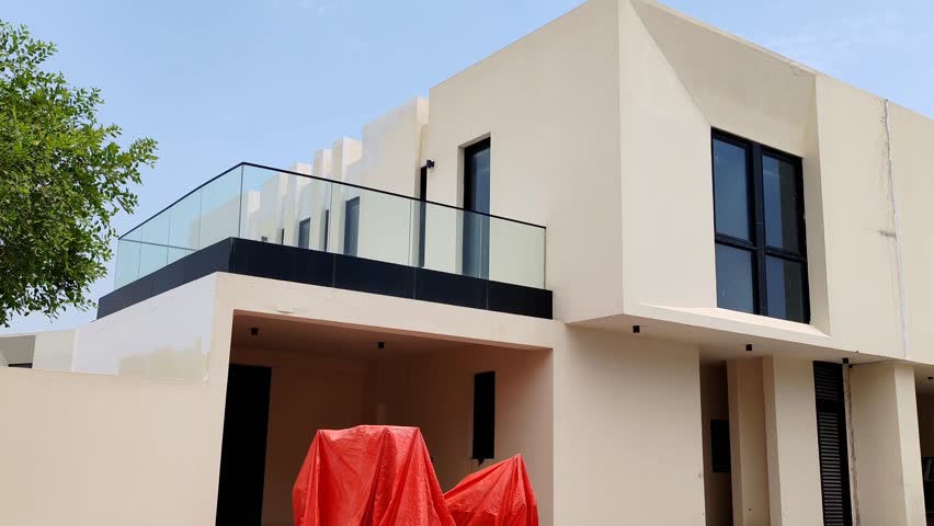 House or Villa's, Villa's with Cream color, Exterior view of 02 story house with modern design and having black glass windows, House or Villa's, Villa's with modern design
Residential Homes, Houses