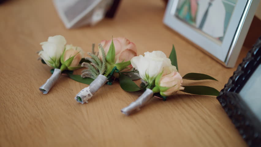 Bride bouquet of flowers, Beautiful bridal bouquet on the table, groom boutonniere, Wedding day, Bride's bouquet. wedding preparations