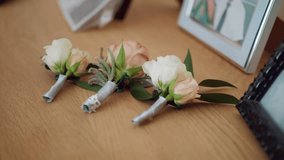 Bride bouquet of flowers, Beautiful bridal bouquet on the table, groom boutonniere, Wedding day, Bride's bouquet. wedding preparations - Powered by Shutterstock - Get 15% off with code: PIKWIZARD15