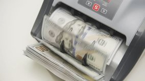 Counting Machine Processing US Dollar Banknotes - Powered by Shutterstock - Get 15% off with code: PIKWIZARD15