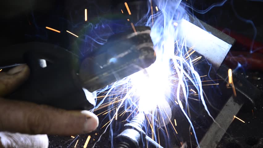 Welding with sparks, Man Welding Extreme Close Up