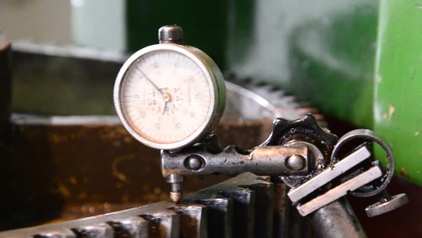 dial gauge instrument measures inclination of cogwheel gear ready for service