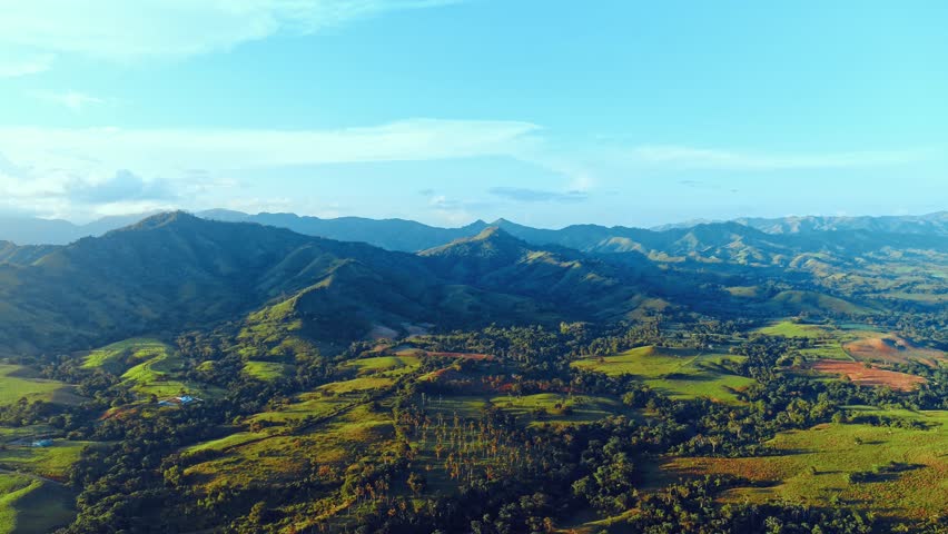 Magnificent mountain range of Dominican Republic in the morning sunlight. Panorama of beautiful wild nature of Latin America. Amazing mountain landscape. World of beauty. Tourism and holiday concept.