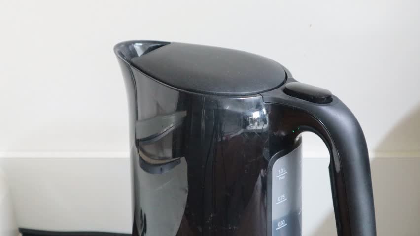 The water is boiling in the electric kettle