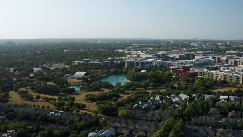 Drone Flyover and Tilt Down Above Mueller Lake of Austin, Texas