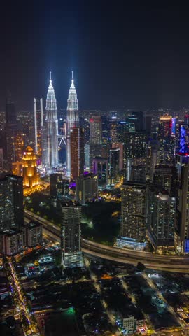 Aerial timelapse of Kuala Lumpur city skyline at night, Malaysia