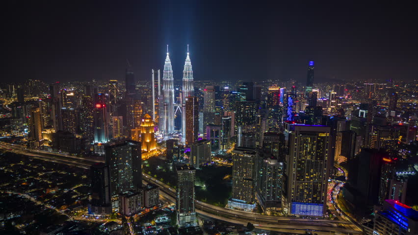 Aerial timelapse of Kuala Lumpur city skyline at night, Malaysia
