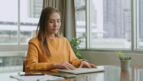 Portrait of smiling beautiful Asian businesswoman enjoy the idea sitting at home office.Freelance woman working online sale marketing. Shopping online at home - Powered by Shutterstock - Get 15% off with code: PIKWIZARD15