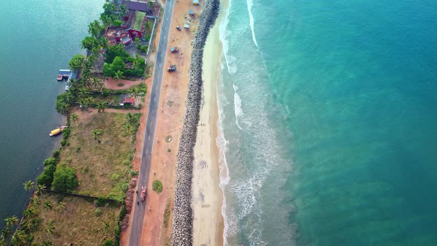 Varkala Long sand beach and calm sea water. South cliff, Varkala, Kerala, India.