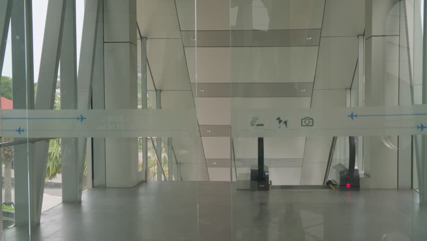 Automatic glass doors open and close.