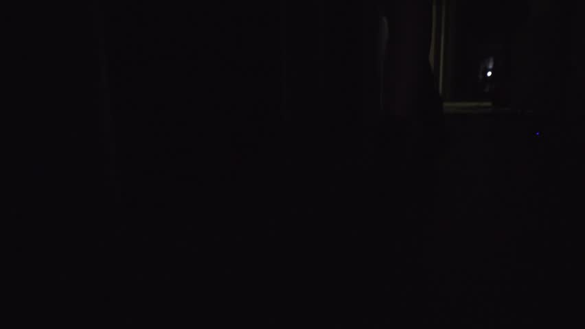 a girl in rough boots with untied laces runs away. light flashing. hd