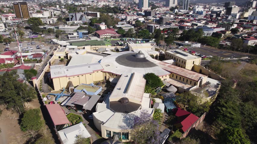 Aerial view capturing the Costa Rican Center of Science and Culture located in San Jose, Costa Rica. Urban cityscape with surrounding buildings and greenery.
