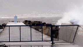 Hermanus New Harbour pier breakwater with dolosse slammed with sea waves, slomo - Powered by Shutterstock - Get 15% off with code: PIKWIZARD15