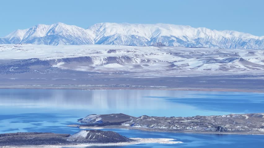 A expansive landscape drone shot of Mono Lake in California.