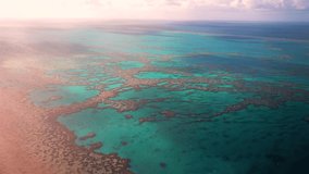 Hardy Outer Great Barrier Reef lagoon heart reef scenic flight aerial drone Whitsundays Islands Australia QLD National Park sunny serene coral formation clouds clear blue aqua ocean waters hazy pan - Powered by Shutterstock - Get 15% off with code: PIKWIZARD15