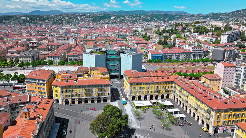 European elite houses with tiles on the roof and colourful buildings in Nice, France. Aerial view of French Riviera, a European elite resort in Nice.