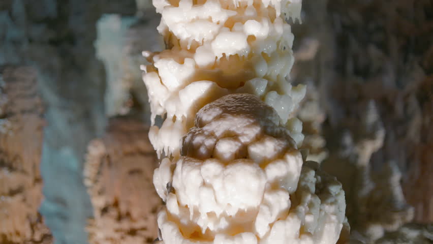 Frasassi Caves, stalagmite formation. White calcite rock, geology in Marche, Italy