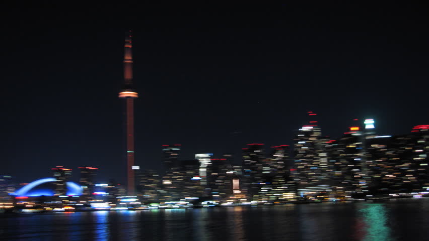 Toronto Skyline Frantic Night Timelapse. Frantic ferry ride in Toronto harbor