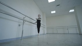 Young ballet girl at studio lesson. Training performance. Stretching exercise pose. Ballerina practice balance technique. Classical elegance fitness. - Powered by Shutterstock - Get 15% off with code: PIKWIZARD15