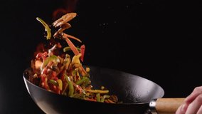 Chef cooking flambe shrimps with oil on wok frying pan close-up. Prawns on fire throwing them in pan. Restaurant Food concept. Sea food. - Powered by Shutterstock - Get 15% off with code: PIKWIZARD15