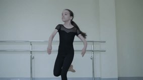 Young ballet girl at studio lesson. Training performance. Stretching exercise pose. Ballerina practice balance technique. Classical elegance fitness. - Powered by Shutterstock - Get 15% off with code: PIKWIZARD15